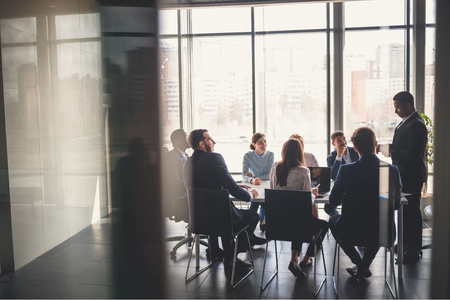 Members of the Rameda team in a meeting around a boardroom table